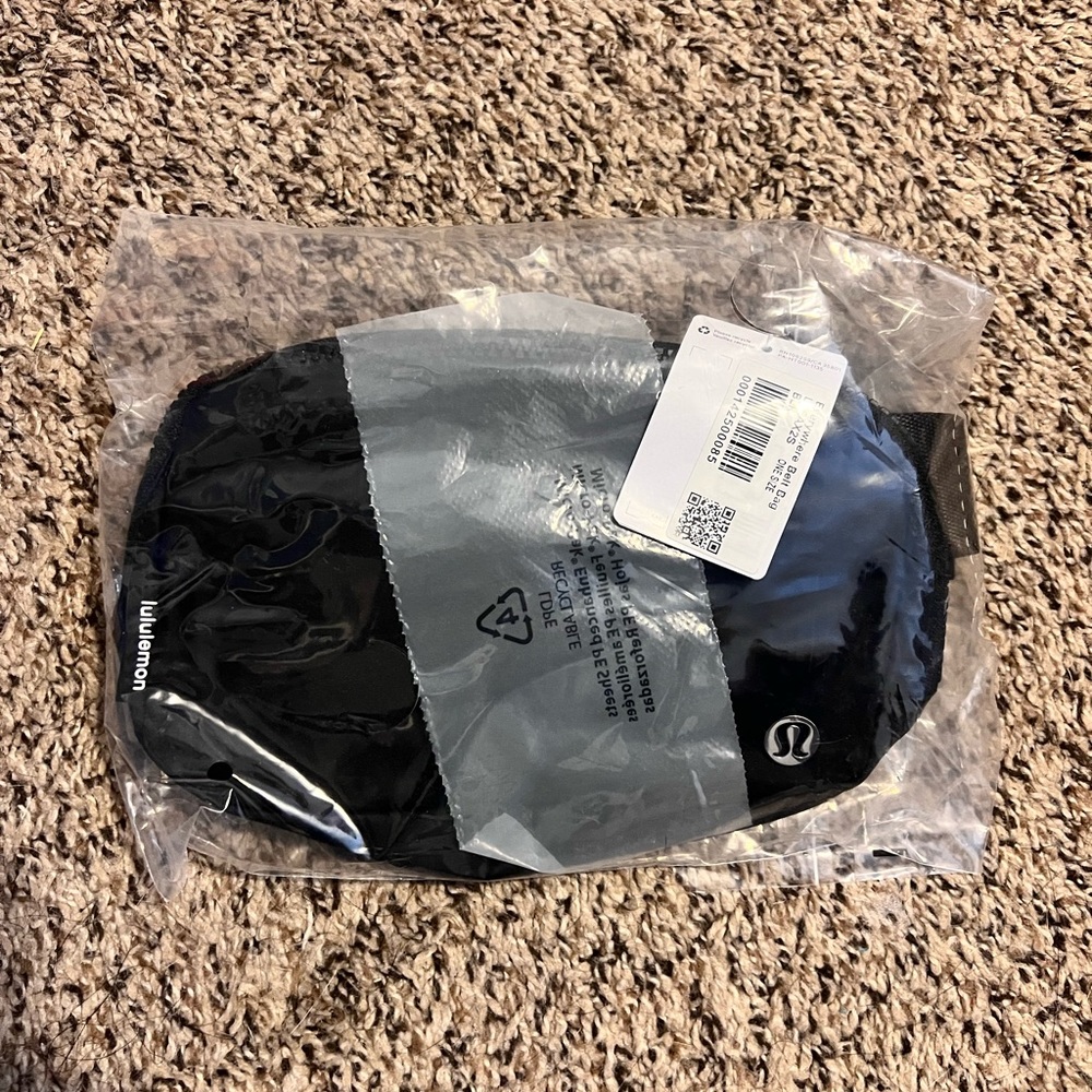 Brand new 1L black belt bag.